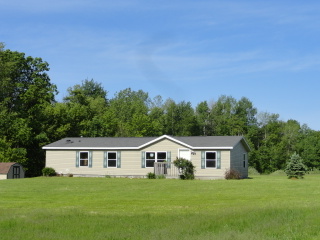 6519 N Hillman Road, Six Lakes, MI 48886 